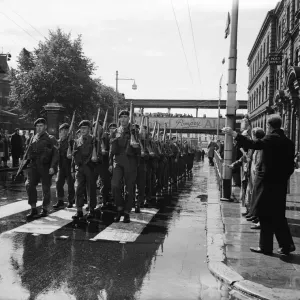 Suez Crisis 1956 People in the streets cheer and wave as troops march form Suez Crisis 1956 People in the streets cheer and wave as troops march form