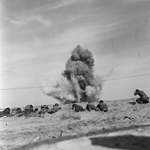Suez Crisis 1956 Royal Engineers take cover as they blow up a mine from a beach