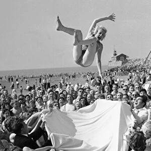 Sunday Pictorial 1957 Beach Party. Angela Manselle seen here being giving the bumps