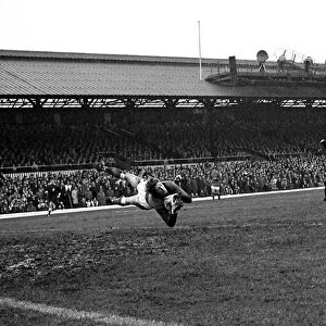 Sunderland goalkeeper Jim Montgomery dives spectacularly to make a fine save