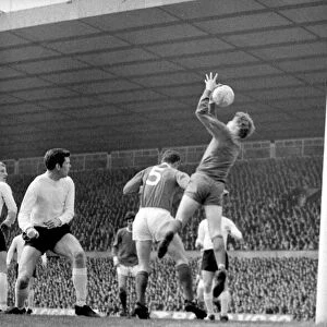 Sunderlands Jim Montgomery leaps high to hold this ball during a Manchester United raid