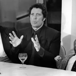 Print of Tom Jones with grandson at press conference
