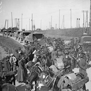 Supply train of the 3rd Lahore Division seen here passing French troops after leaving