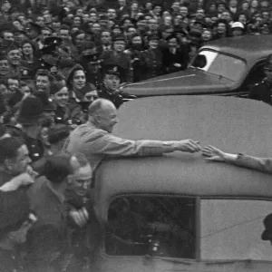 Supreme Allied Commander General Dwight D Eisenhower shakes hands with a woman from Supreme Allied Commander General Dwight D Eisenhower shakes hands with a woman from