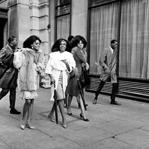 The Supremes walking in Great Cumberland Street, London holding umbrellas 15th March 1965