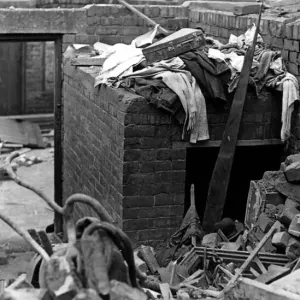 A surface air raid shelter in a backyard which was undamaged when a bomb wrecked a house A surface air raid shelter in a backyard which was undamaged when a bomb wrecked a house
