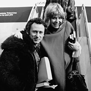 Susannah York and her husband - February 1972 Boarding the plane for