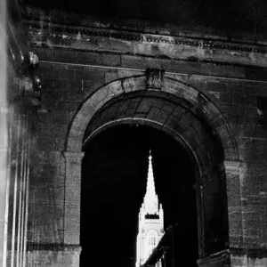 Through the suspension bridge arch under which two girls shelter All Saints Church Through the suspension bridge arch under which two girls shelter All Saints Church