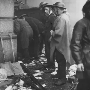Swansea blitz - A rescue squad looking for burned people in a shelter. June 1941 Swansea blitz - A rescue squad looking for burned people in a shelter. June 1941