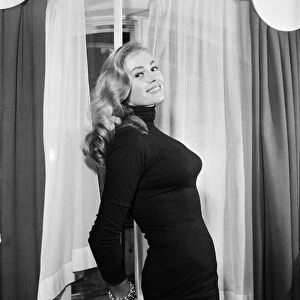 Swedish actress, Anita Ekberg, pictured in her hotel room at The Savoy, London