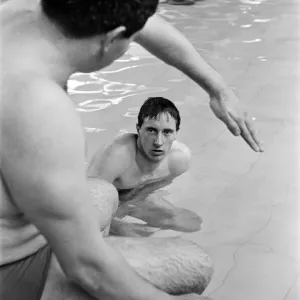 Swimmer Bobby Lord (in pool) with coach Graham Symonds. 8th November 1965 Swimmer Bobby Lord (in pool) with coach Graham Symonds. 8th November 1965