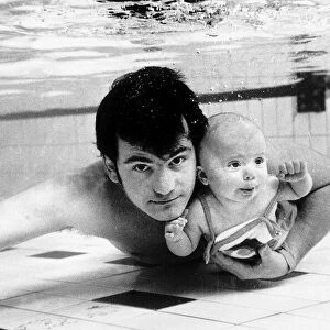 Swimming Underwater baby Tracey four months old with father Steve Appleby
