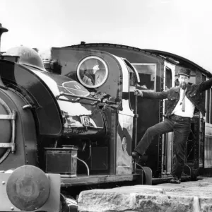 Tanfield Railway Association guard Bob Payne flags away the newly-commissioned Hawthorn