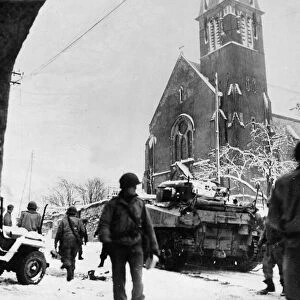 Tanks of the United States 35th Infantry Division moving through the Belgian town of