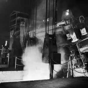 Tapping molten steel from a 30 ton electric arc furnace at the English Steel Corporation Tapping molten steel from a 30 ton electric arc furnace at the English Steel Corporation