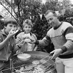 Tasty... Trying out the hotdogs at a summer fete held in the grounds of Longdenholme old