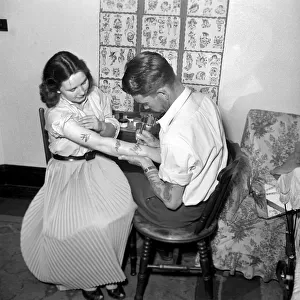 Tattoo artist D. A. Deller seen here at work in his St. Leonards Studio. June 1957 A416