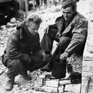 The tea ritual is observed even among the ruins of Ortona, Italy for Canadian soldiers K The tea ritual is observed even among the ruins of Ortona, Italy for Canadian soldiers K