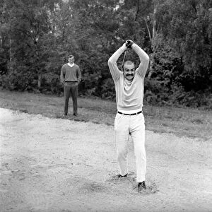 Ted Dexter and Sean Connery at Coombe Hill Golf Course. Sean is seen here showing his