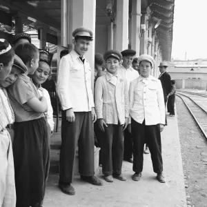 Teenage boys seen here waiting on the platform of an un-named town in central Russia Teenage boys seen here waiting on the platform of an un-named town in central Russia