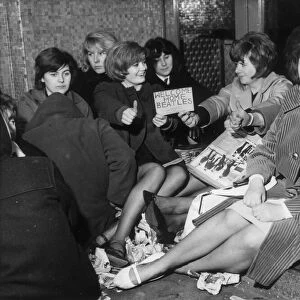 Teenagers queue in queued in the rain at the Majestic ballroom in Birkenhead from 5am for