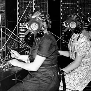 Telephone girls at Whitley Bay Post Office try out the gas masks as they prepare for any