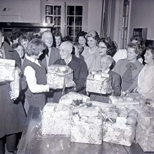 Telephonists at Coventry Telephone Exchange presenting Christmas food parcels to 13