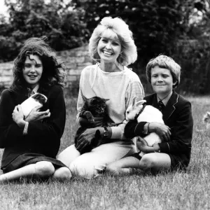 Television presenter Cathy Secker with Jane, David, a guinea pig, cat and rabbit Television presenter Cathy Secker with Jane, David, a guinea pig, cat and rabbit