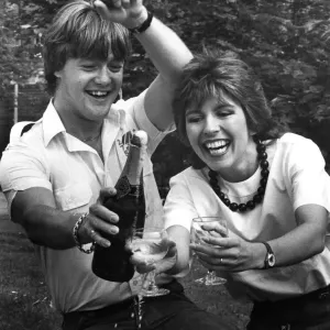 Print of Maggie Philbin and Keith Chegwin with champagne