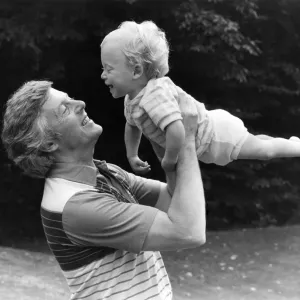 Television presenter Michael Aspel with son in a 1982 Print