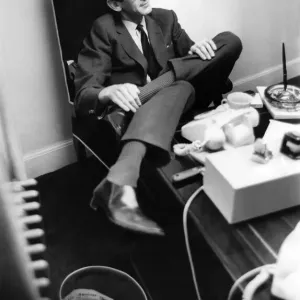 Television presneter Denis Norden sits, a lonely figure at his partnership desk Television presneter Denis Norden sits, a lonely figure at his partnership desk