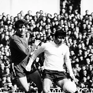 Terry Venables of Tottenham holds off Ian Hutchinson Mar1969 of Chelsea during