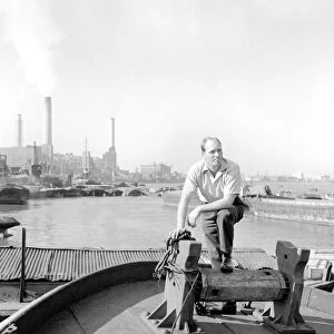 Thames barge man Ernest Murray seen here at work on the river. Circa 1960