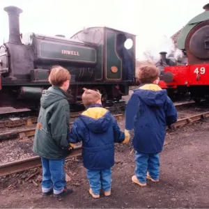 Thee little ones study steam locomotives at the Tanfield Railway engine sheds which were Thee little ones study steam locomotives at the Tanfield Railway engine sheds which were