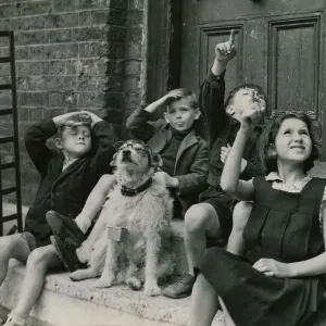 Thousands of London children are still frequenting the streets during the flying bomb