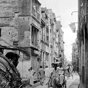 Tikka Khan Street Dacca flying Pakistan flags from the windows following the fighting