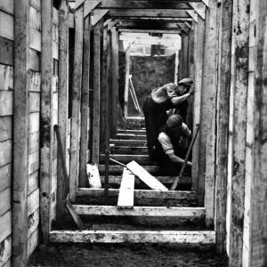 Timbering up the deep trenches in Birkenhead Park. The shelters will have seats along Timbering up the deep trenches in Birkenhead Park. The shelters will have seats along