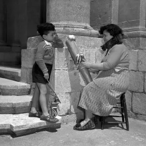 Tinkers in Malta 1954 Mrs Eucaristica Borg photographed as she works in