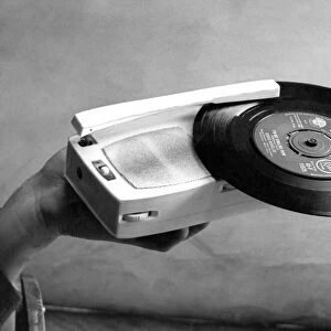 A tiny record player which is also a transistor radio in March 1963 27 / 03 / 63