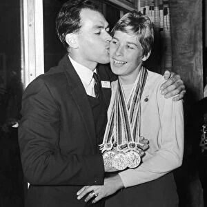 Tokyo Gold Medalist Mary Rand is met by her husband Sid on her return from the Olympic