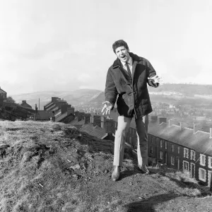 Tom Jones, a boy on top of the world, sings from the mountain top above his hometown of Tom Jones, a boy on top of the world, sings from the mountain top above his hometown of