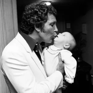 Tom Jones with his grandson Alexander, aged eleven months, in their London hotel