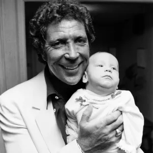 Tom Jones with his grandson Alexander, aged eleven months, in their London hotel