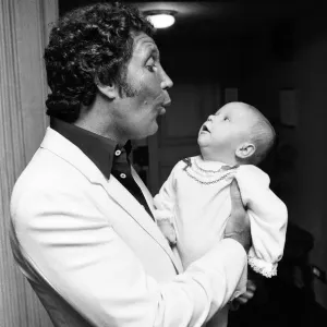 Tom Jones with his grandson Alexander, aged eleven months, in their London hotel
