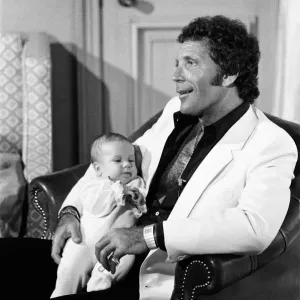 Tom Jones with his grandson Alexander, aged eleven months, in their London hotel