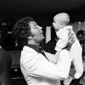 Tom Jones with his grandson Alexander, aged eleven months, in their London hotel