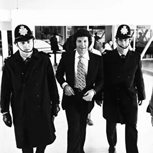 Tom Jones Pop Singer being escorted by Police at Heathrow Airport