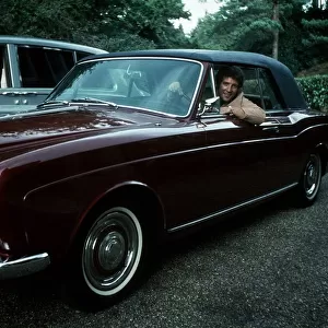 Tom Jones Singer in the driving seat of a Rolls Royce