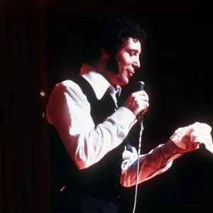 Tom Jones singer singing microphone open necked shirt waistcoat hankerchief Tom Jones singer singing microphone open necked shirt waistcoat hankerchief