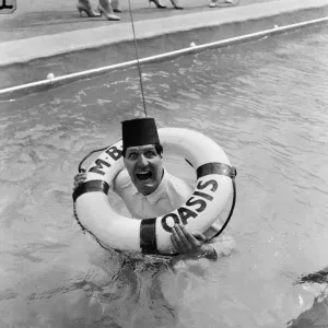 Tommy Cooper opening the Oasis outdoor swimming pool in Holborn for the season